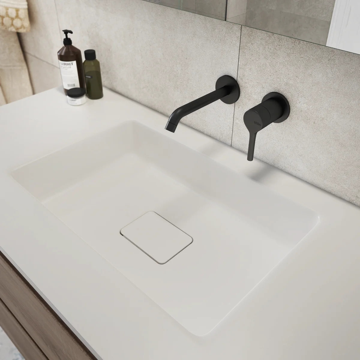 Grifo de lavabo empotrado a pared Stillo Hades acabado negro mate liso con caño de 176mm diseño minimalista moderno